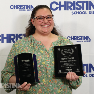 Photo of Danna Phanos Teacher of the Year Shue-Medill MS holding award